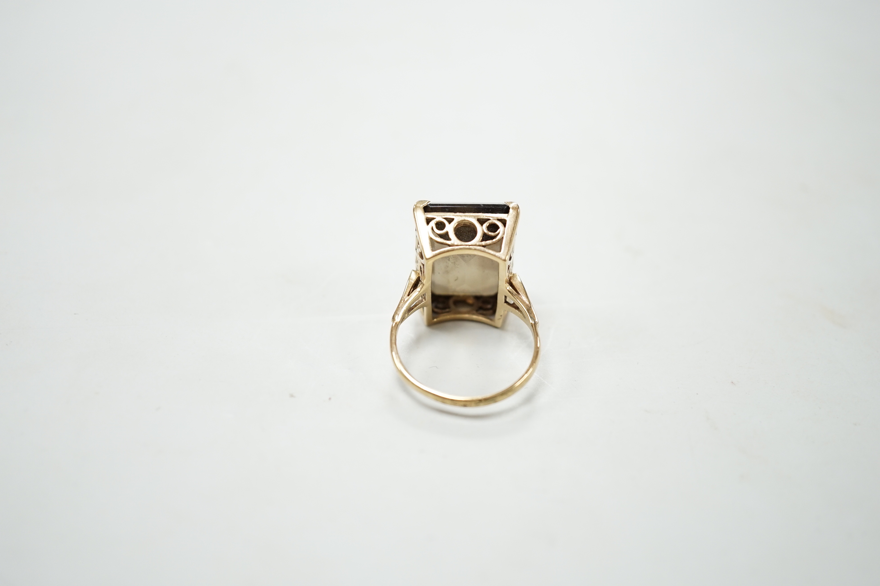 A 9ct gold and single stone smoky quartz set dress ring, size T, gross weight 8.5 grams.